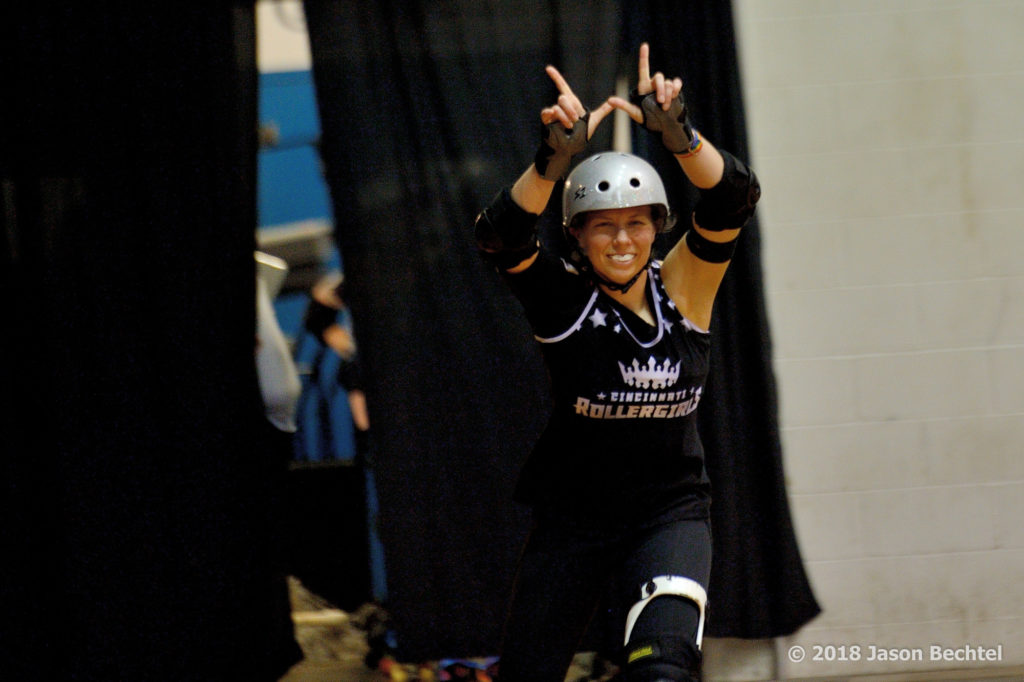 Wheezy makes a W with her hands during skater intro at Schmidt Memorial Fieldhouse.