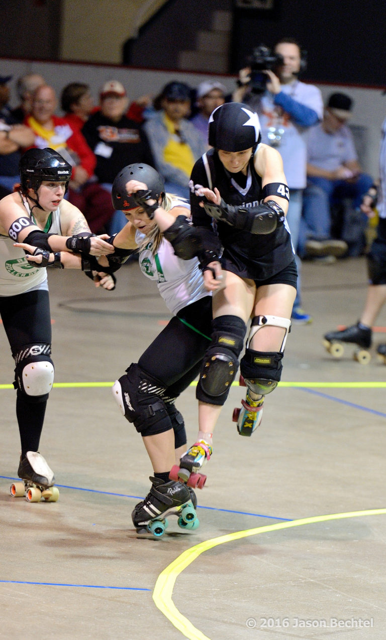 Wheezy jumps the apex during a 2016 Cincinnati Rollergirls game at the Cincinnati Gardens.