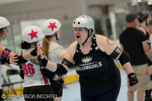 Motley Crouton high-fives opposing skaters. Photo by Jason Bechtel.